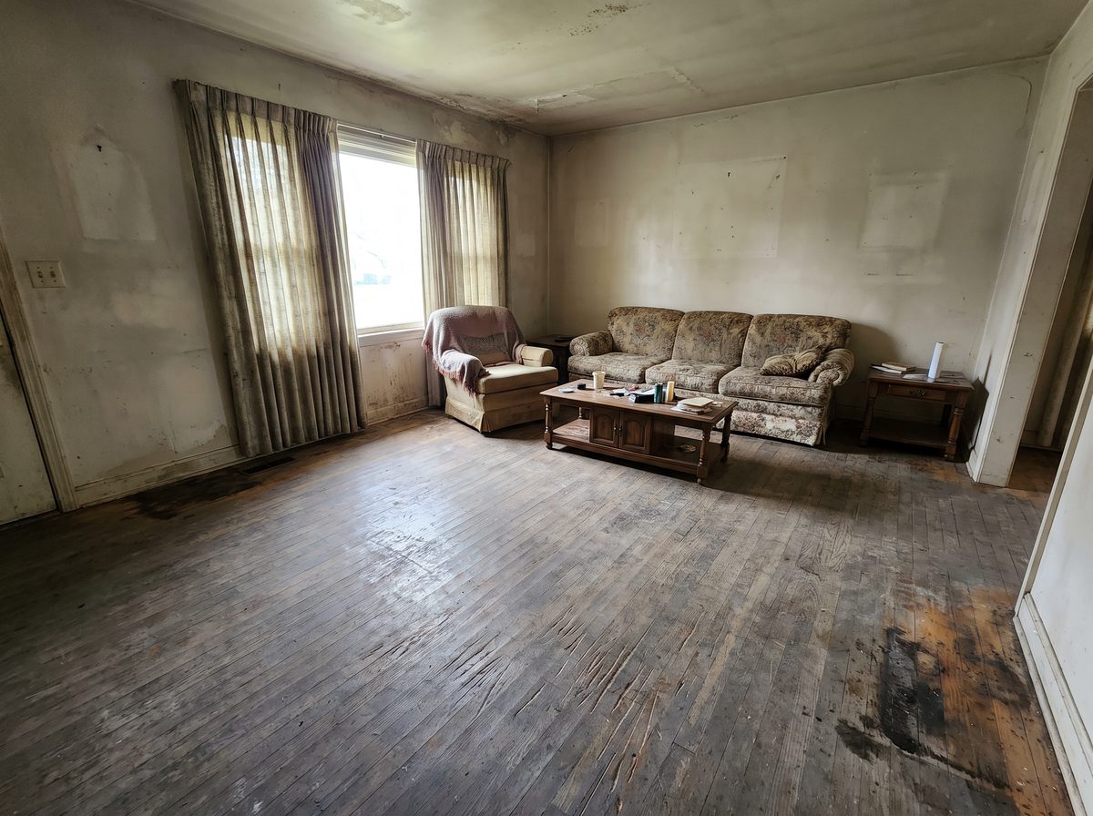 Illustrative example of an old, worn hardwood floor before restoration